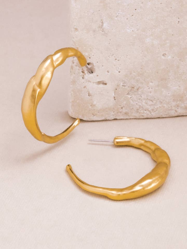 Gold Molten Wave Hoop Earrings for wholesale by Mayana Designs Co
