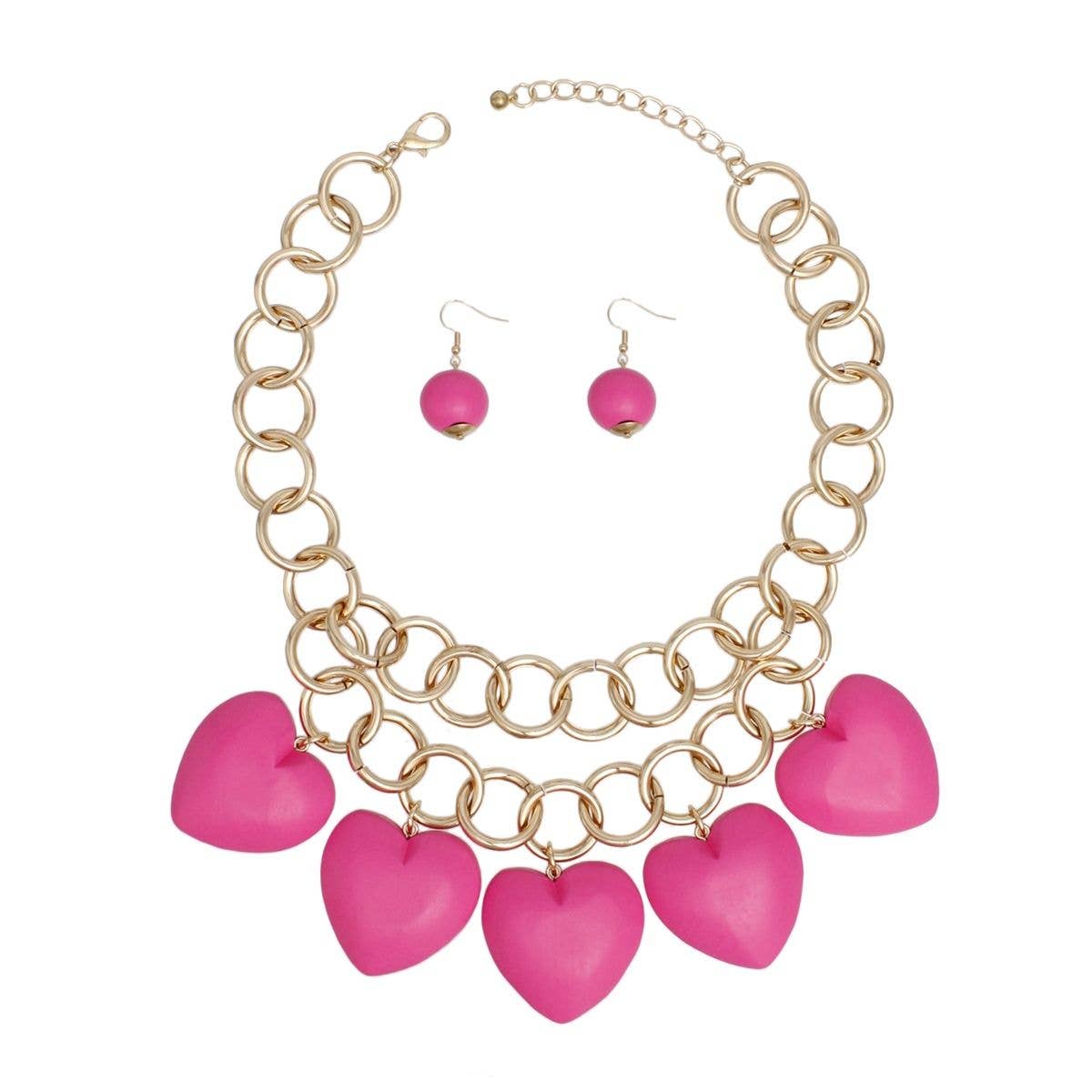 Couleur : Fuchsia Collier à gros maillons fuchsia avec perles en bois en forme de cœur. en vente sur Faire1