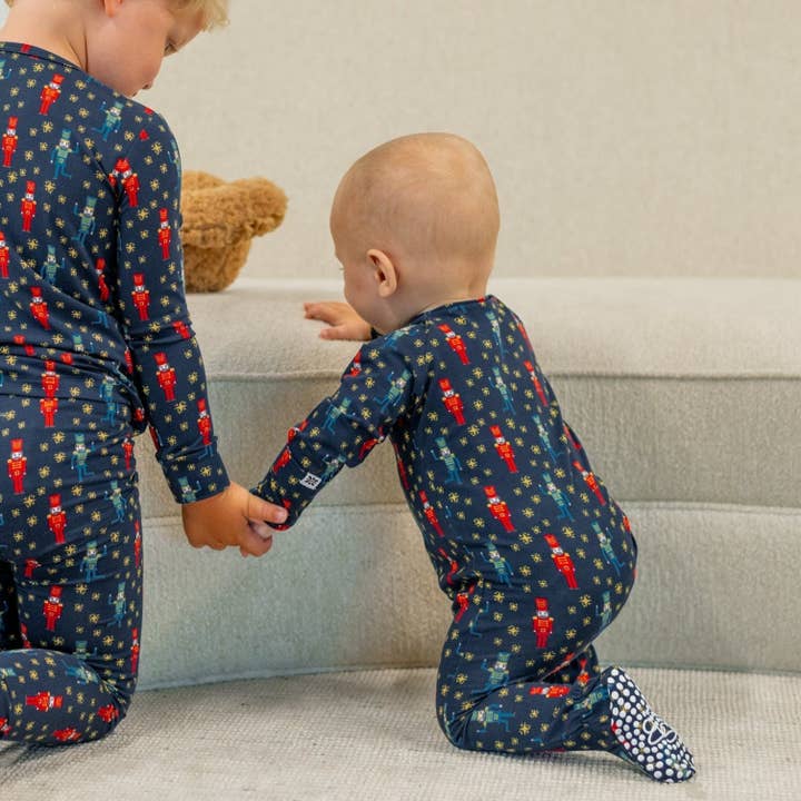 Navy Nutcracker Zipper Footie for wholesale by Sweet Bamboo