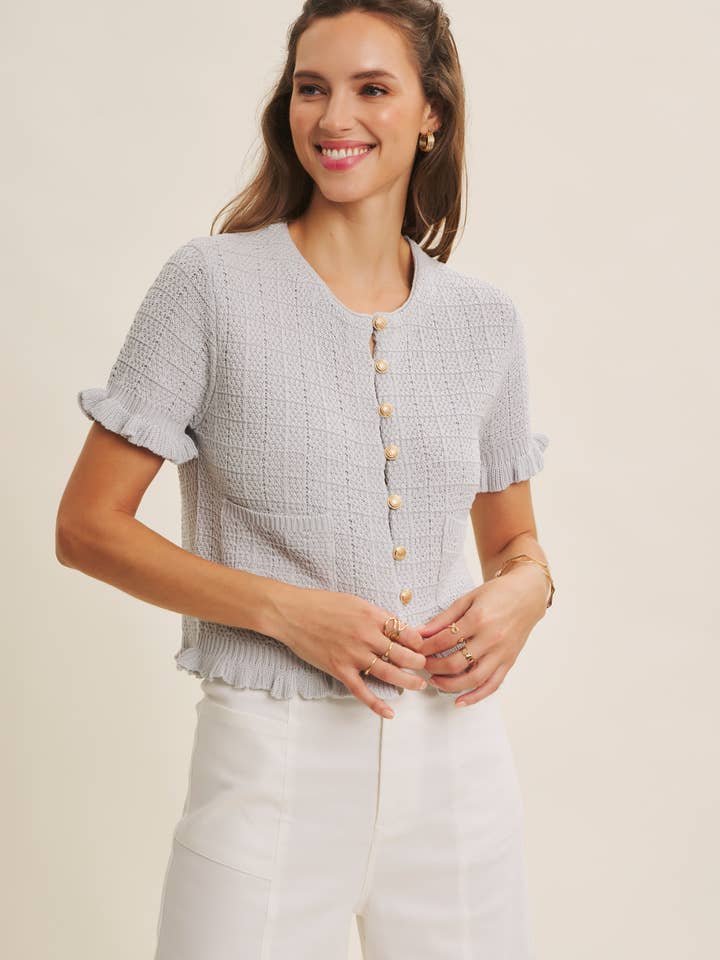 CARDIGAN MAGLIONE TESTURIZZATO DI ELEGANZA SENZA TEMPO CON BOTTONI DORATI per la vendita all'ingrosso da parte di in february