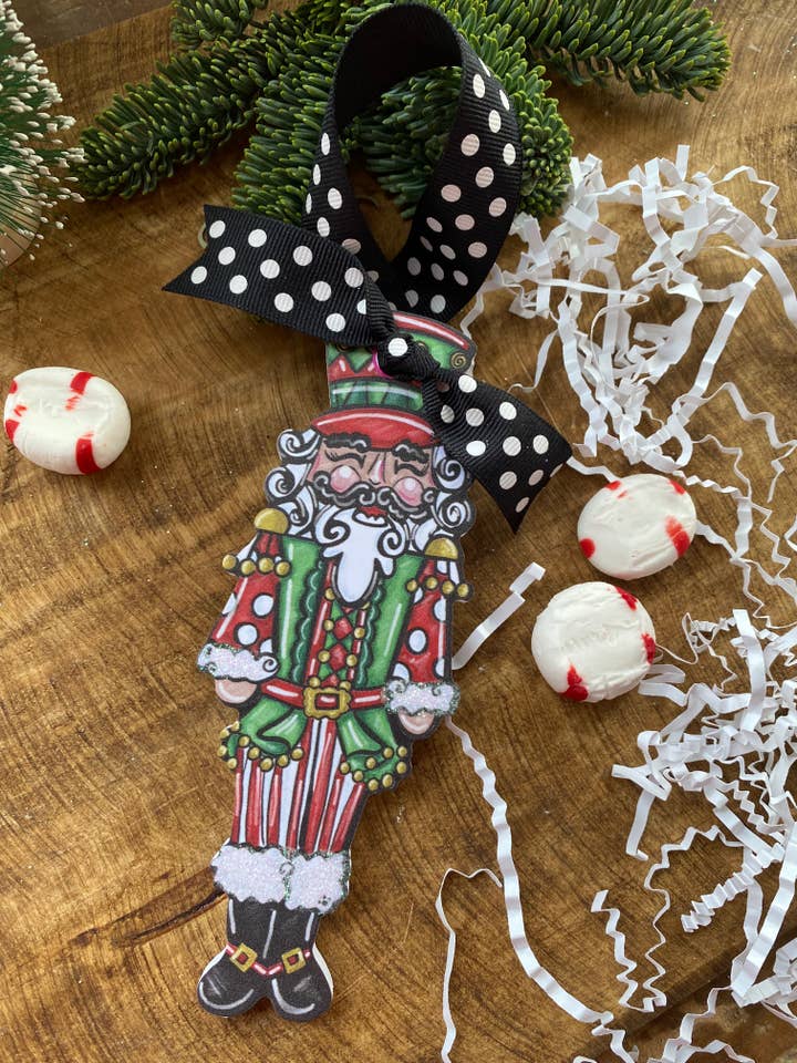 Pink or red nutcracker ornament great for personalizing for wholesale by Pink Fish Studios, LLC.