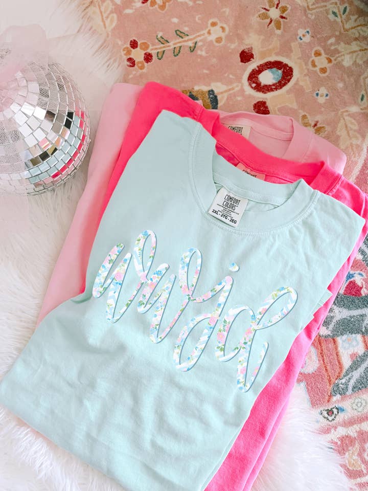 Floral WWJD Tee (Island Reef) for wholesale by Downtown Darling Wholesale