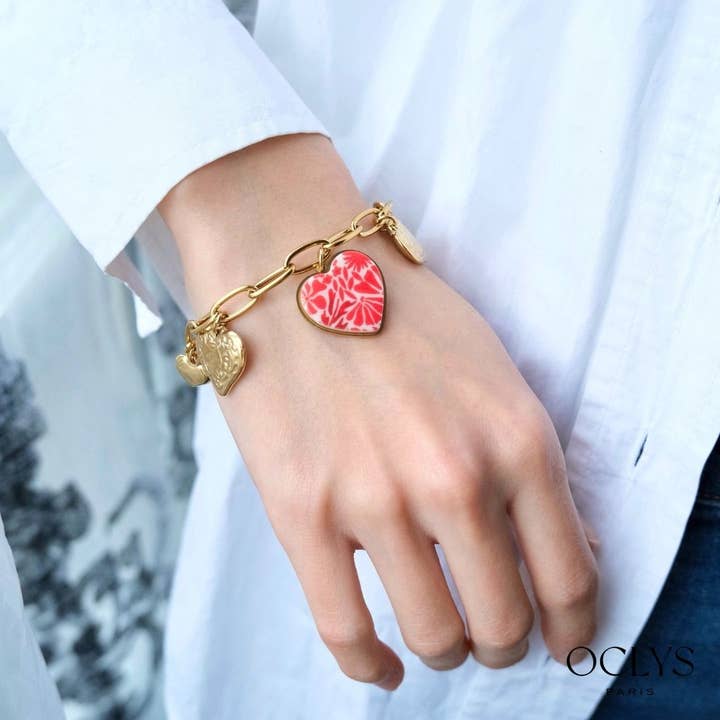 Tania stainless steel heart charm bracelet for wholesale by Oclys