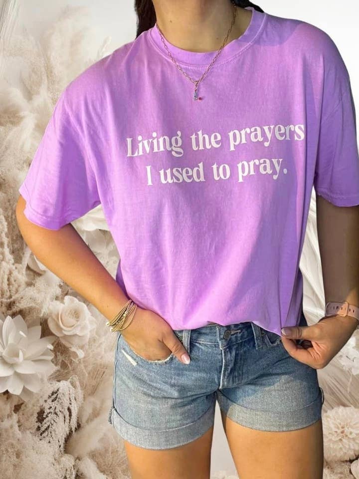 T-shirt illustré Living the Prayers I used to Pray Everyday pour la vente par Truelove Apparel