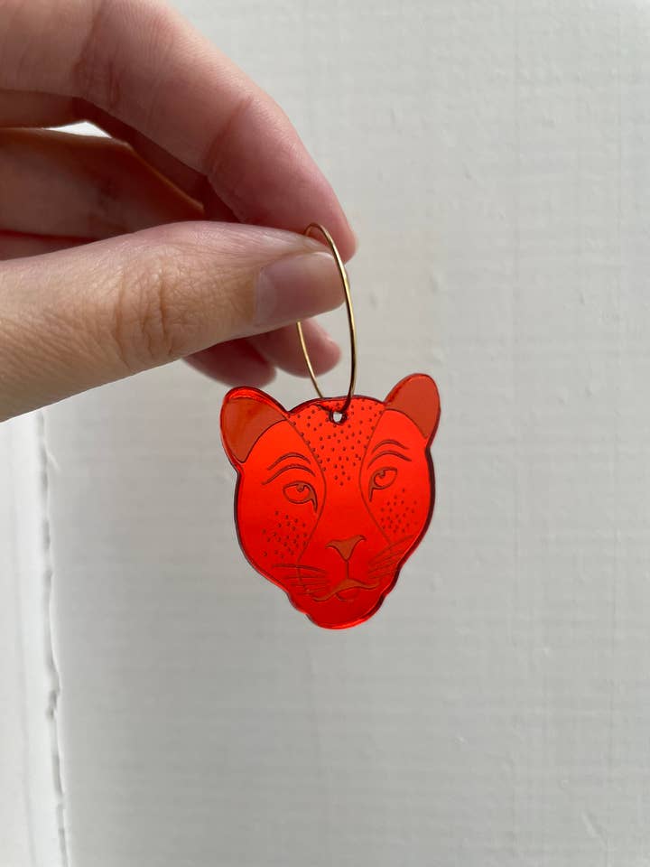 Orange/rød pantercreole for engroshandel hos Le Strict Maximum