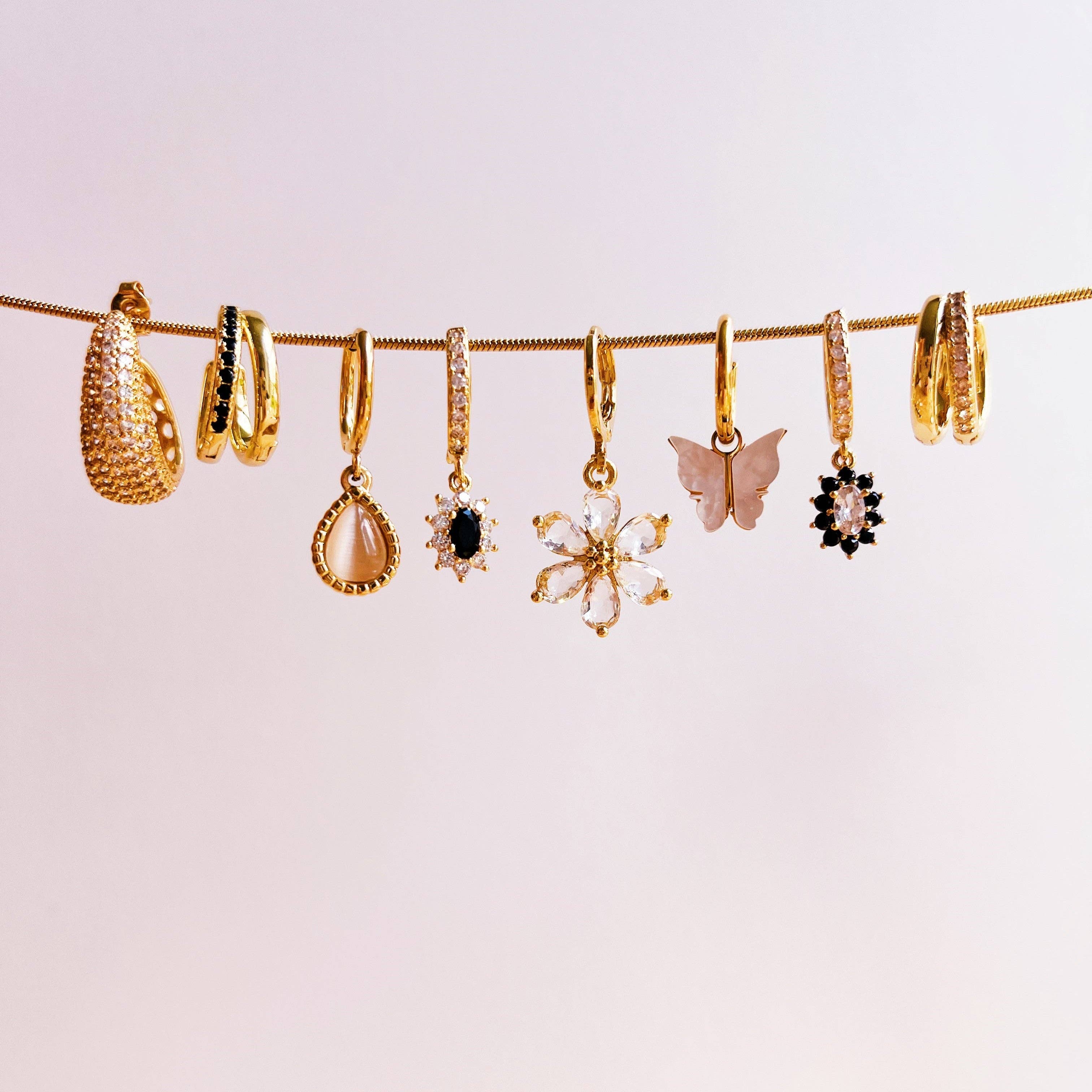 Gold Maria white earrings for wholesale on Faire2