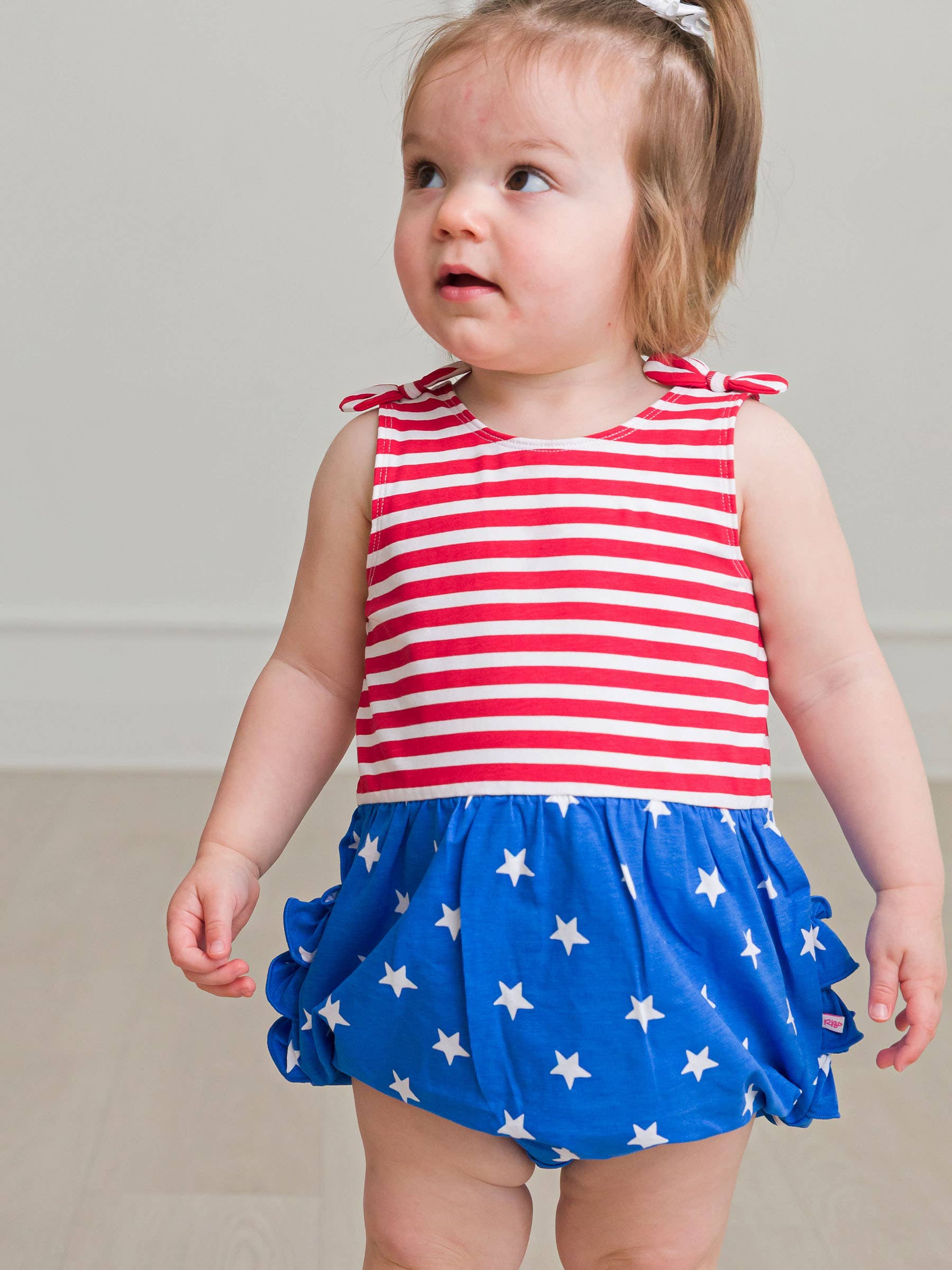 RuffleButts + RuggedButts - Wholesale Romper - Kids - Baby Girls Stars & Stripes Knit Tie Shoulder Bubble Romper4