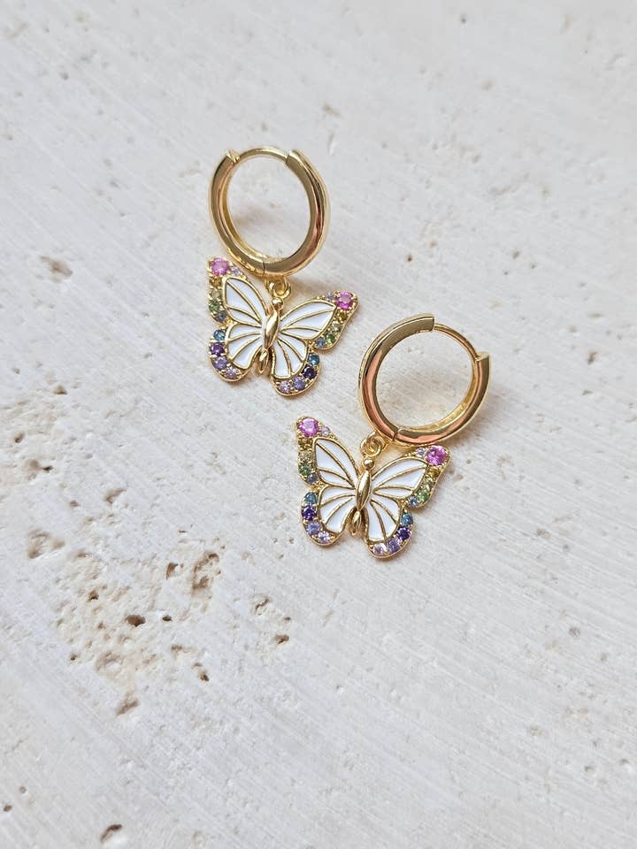 Rainbow Butterfly Huggie Hoops for wholesale by Lotus & Lace Designs