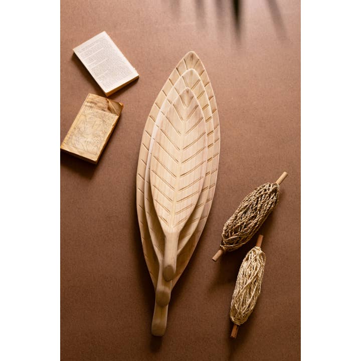 Natural SET OF THREE WOODEN LEAF TRAYS for wholesale on Faire4