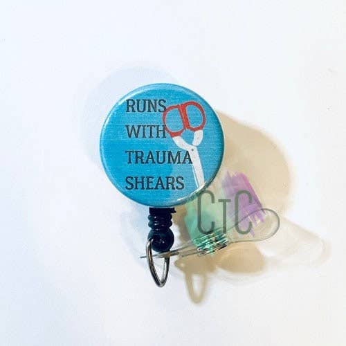 Runs With Trauma Shears Badge Reel for wholesale by Classy Trash Creations