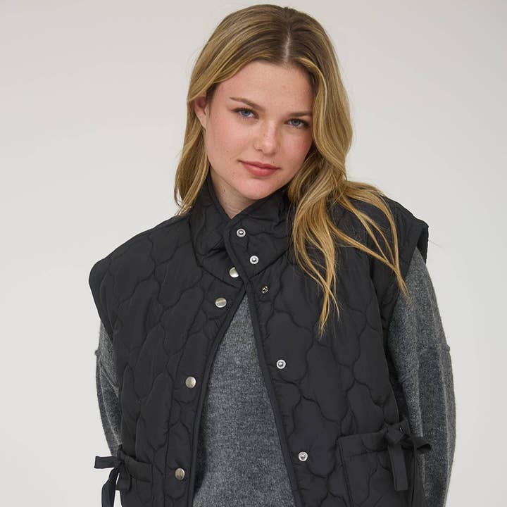 TIE DETAIL SNAP BUTTON DOWN QUILTED PUFFER VEST and other Purchase Wholesale medium snap. Free Returns & Net 60 Terms on Faire trending on Faire.