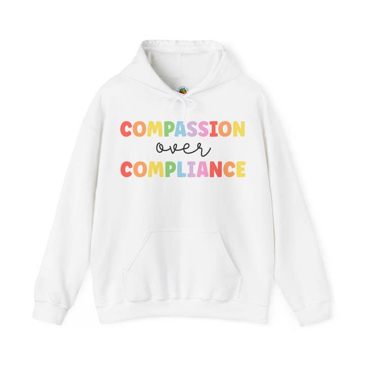 compassion over compliance Unisex Heavy Blend™ Hooded Sweatshirt for wholesale by Apparel Crush