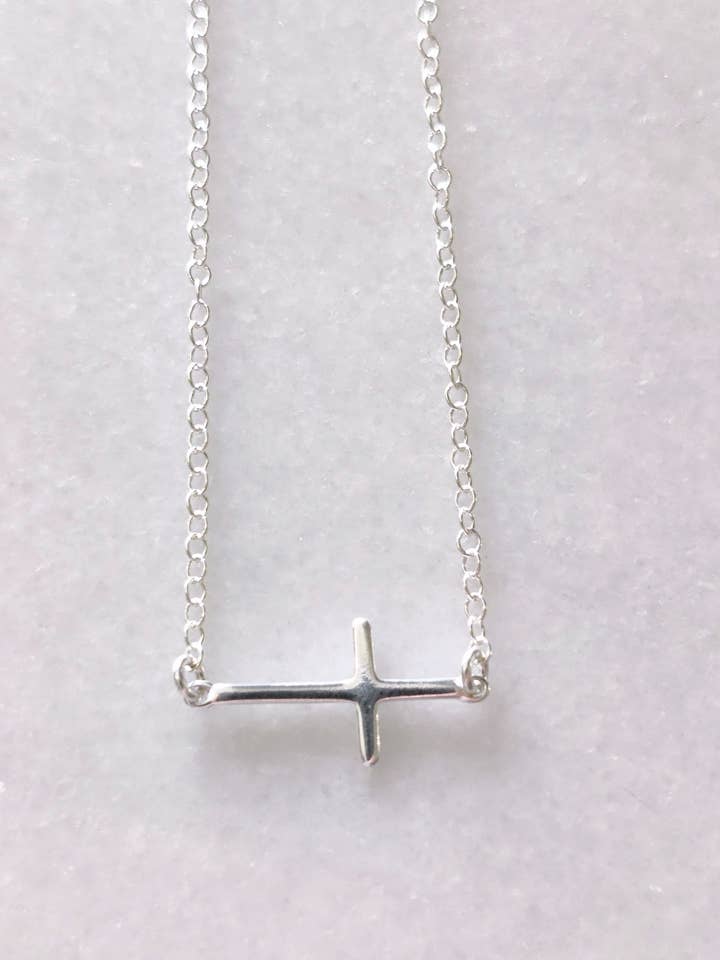 Silver sideways cross necklace for wholesale by Rose Burkhardt Jewelry