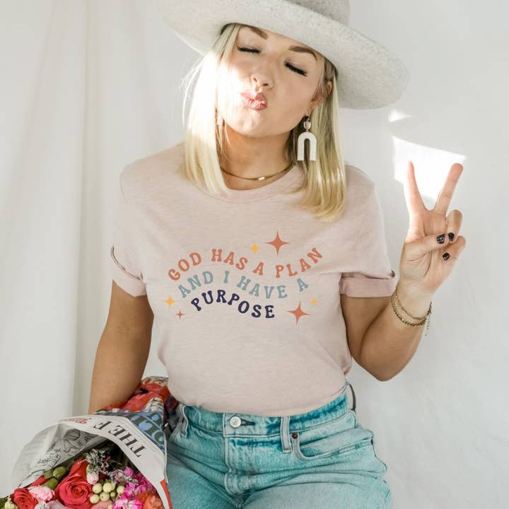 God Has A Plan And I Have A Purpose T-shirt | Graphic Top for wholesale by KM Clothing