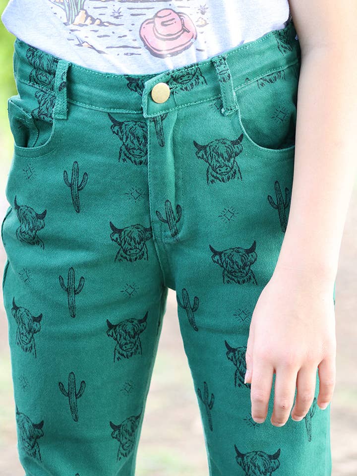GREEN Highland cow & dessert cactus printed bootcut jeans. PNG15113006 jeann for wholesale on Faire1
