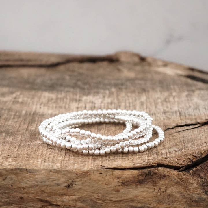 Silver tone small ball beads bracelet stack of 5 bracelets for wholesale by PennyLine inc