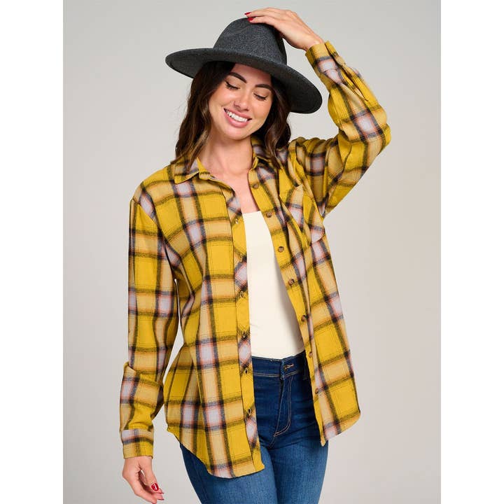 Chemise à carreaux à manches longues avec poche avant et boutons. pour la vente par IWT Brands