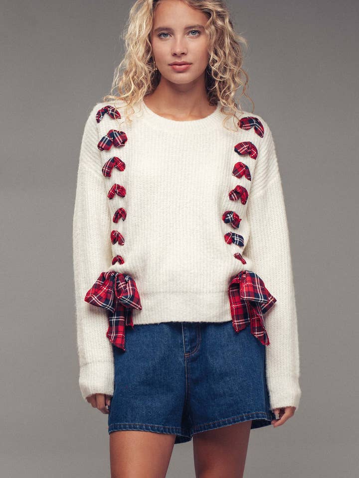 IVORY Plaid Bow Holiday Sweater – Festive Knit, Relaxed Fit for wholesale on Faire7