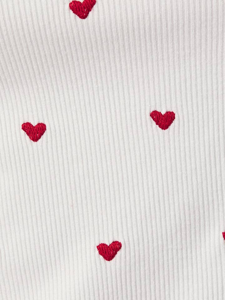 White BOAT NECK SLEEVELESS HEART EMBO RIBBED TANK for wholesale on Faire6