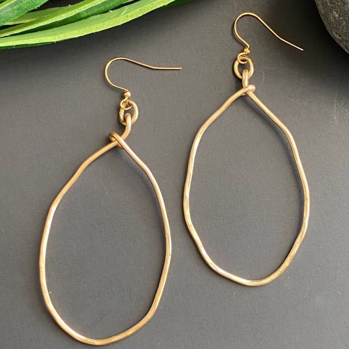 Large Gold Hammered Wavy Oval Hoop Earrings for wholesale by Marble Designs Jewelry
