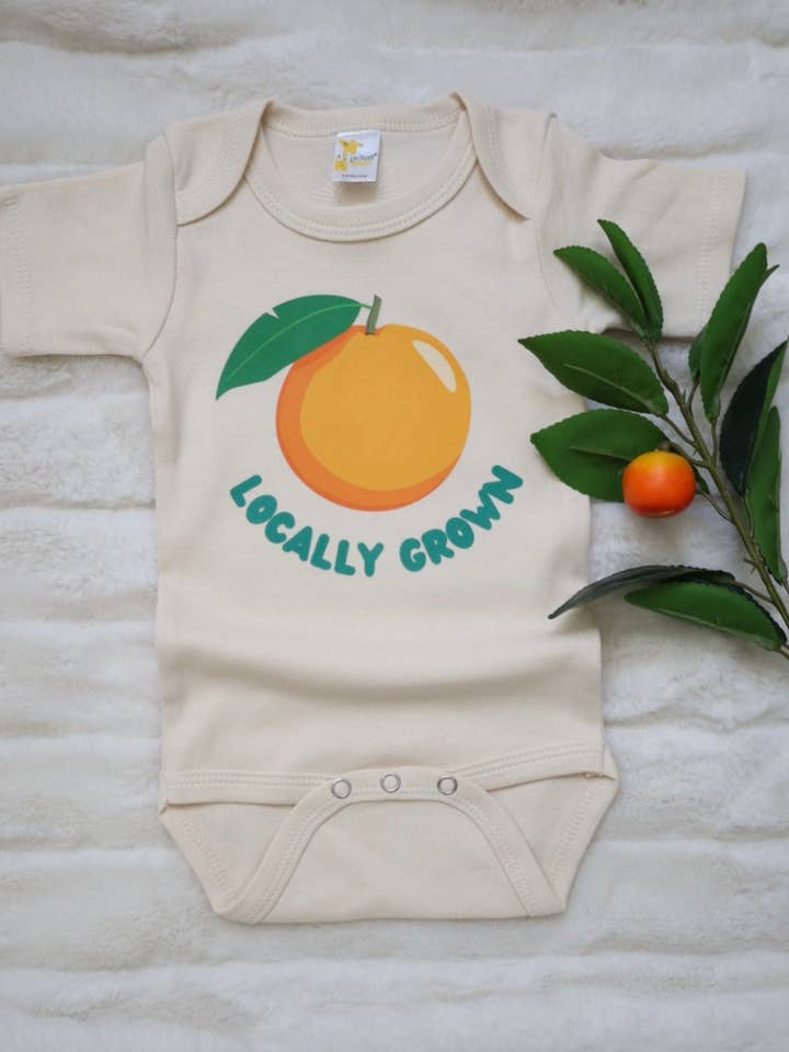 'Locally Grown' gender neutral baby bodysuit for wholesale by Sunshine Collective