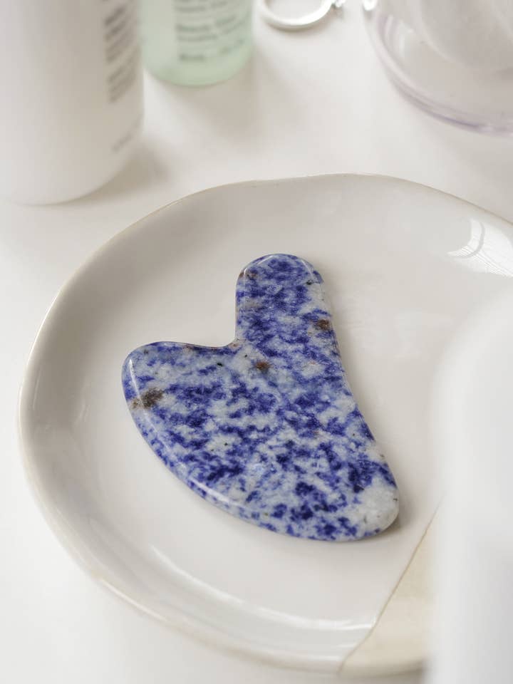 Blue Vein Stone Crystal Gua Sha with Black Skull Pouch for wholesale by Xander Kostroma