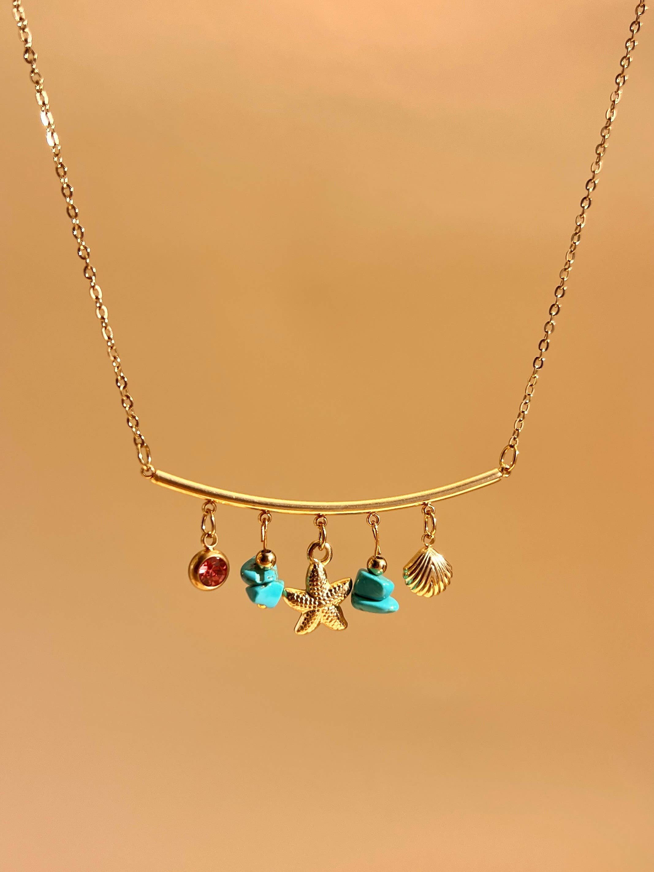 COSMOS – wholesale Pendant/charm necklace – Turquoise and Shell Chic Golden Steel Charm Necklace1