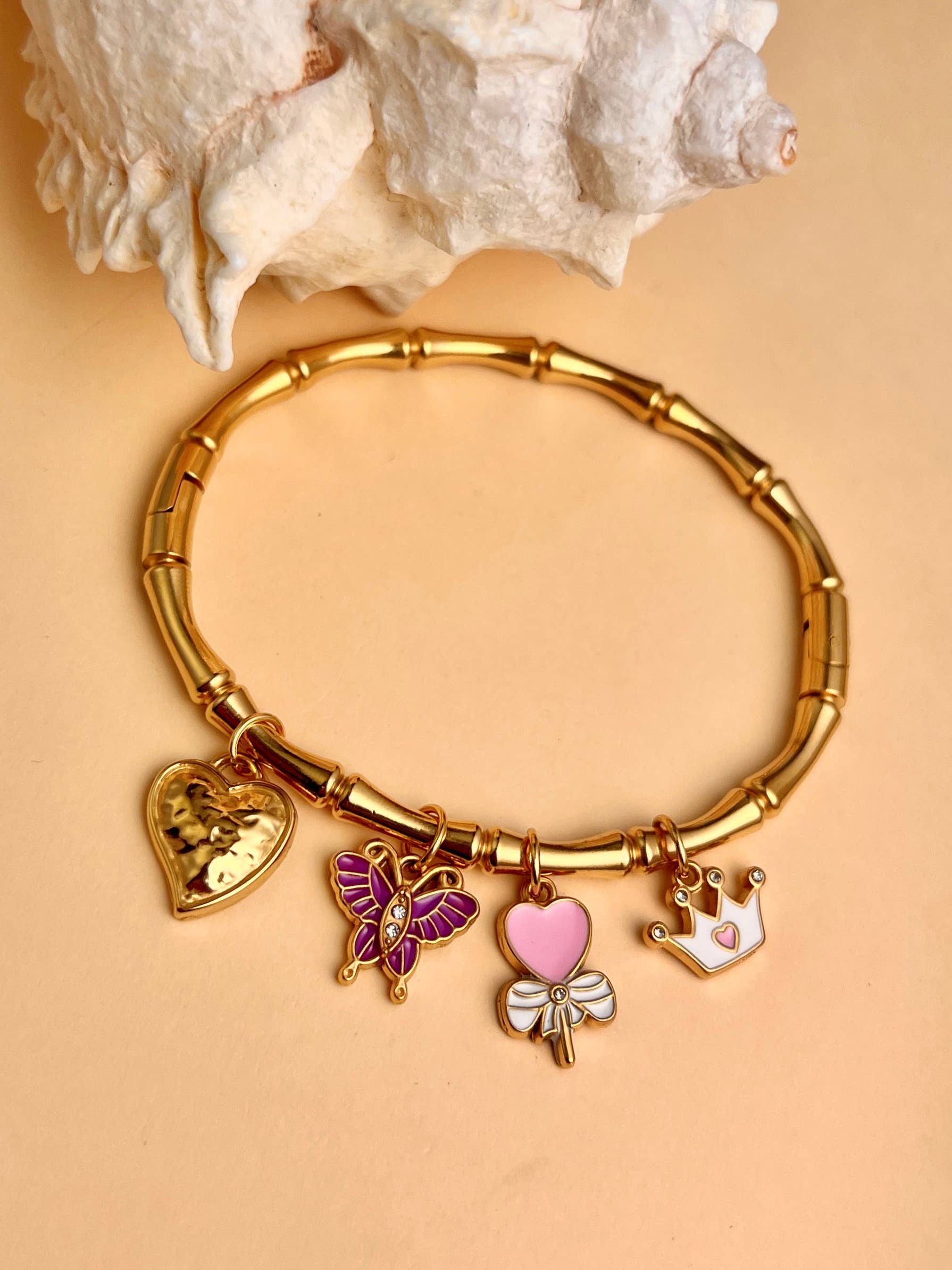 COSMOS - Wholesale Charm/Dangle Bracelet - Heart, butterfly, and crown charm bangle bracelet in steel