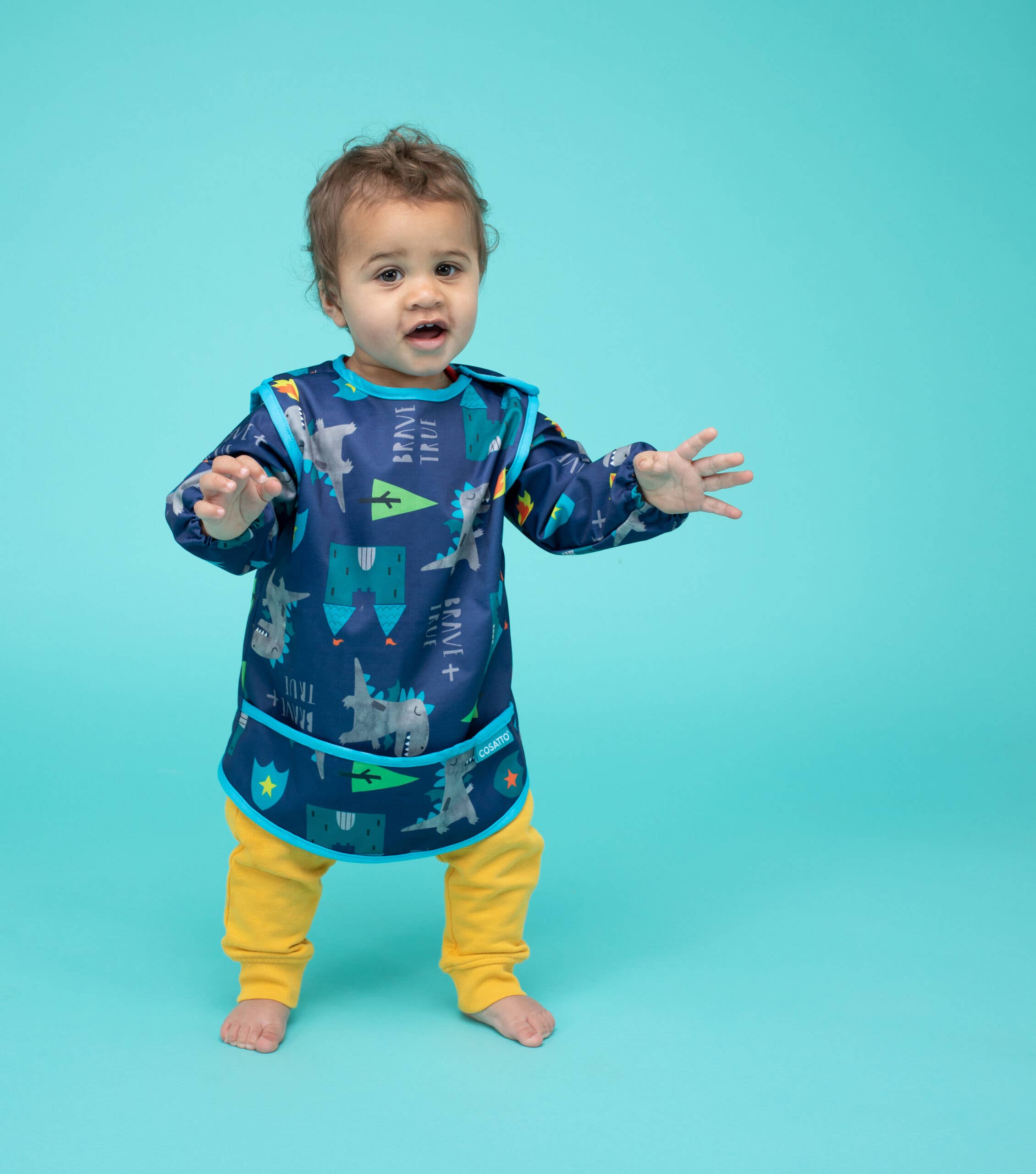 Blue Cosatto Coverall Feeding Bib Dragon Kingdom for wholesale on Faire5