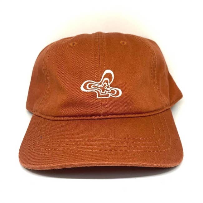 Burnt Orange Baseball Cap w/ Groovy flower for wholesale by Kickback Club