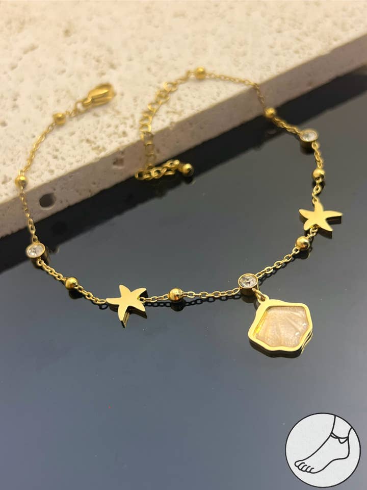 Cavigliera Stella & Conchiglia in acciaio inossidabile per la vendita all'ingrosso da parte di COSMOS