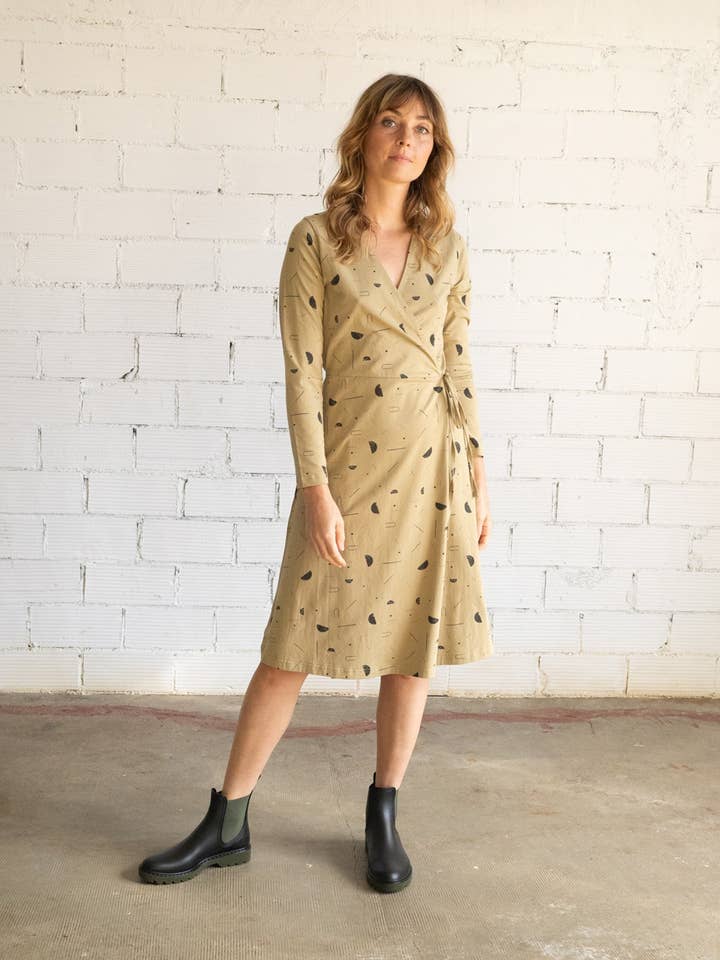 Abito antipioggia siderale beige Gemma Crossed per la vendita all'ingrosso da parte di Tiralahilacha