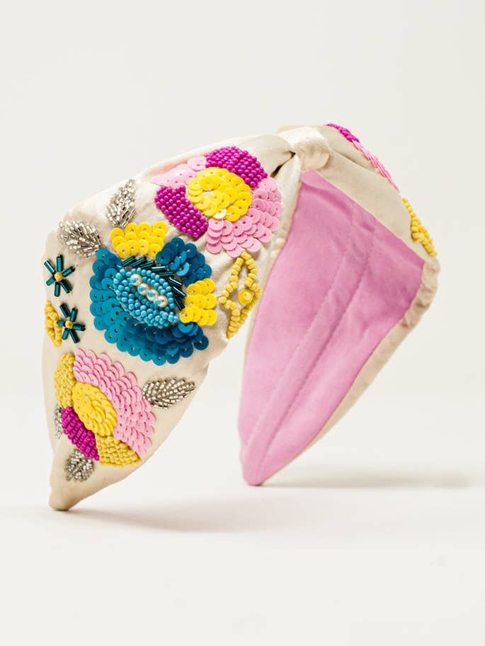 Knotted headband with embellished flowers in cream for wholesale by Q2—All Orders:Free Duties for the US,UK,and Canada