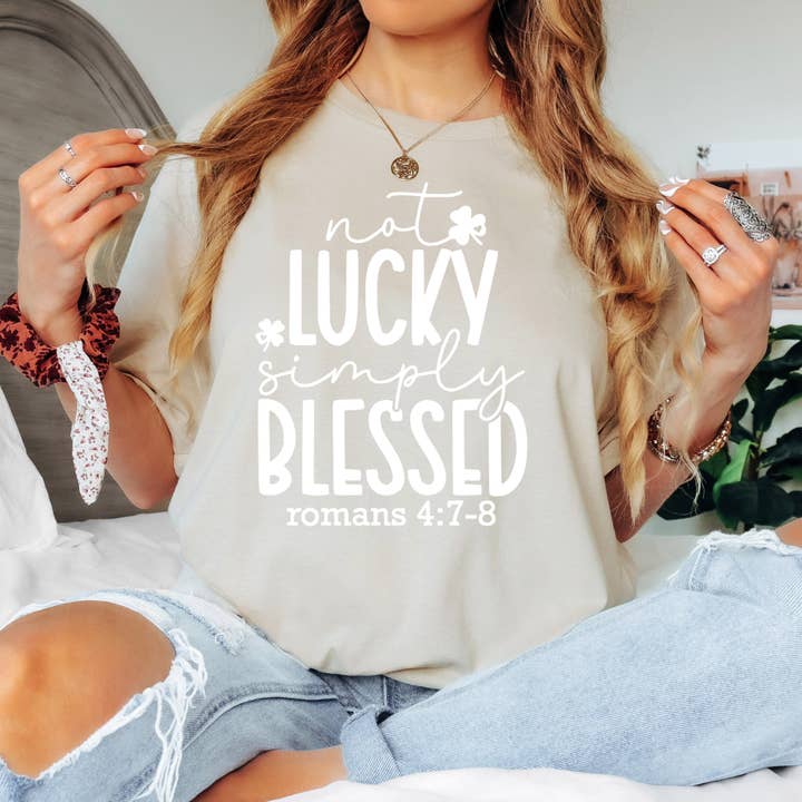 Not Lucky Simply Blessed Shirt (White Font) for wholesale by Timeless Tees Shop