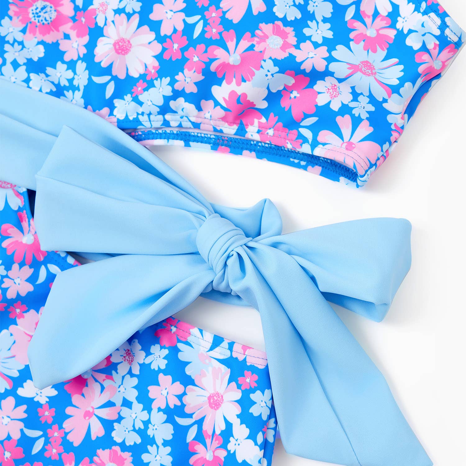 Blue Couple Matching Flora Swim Trunks or One-piece Swimsuit for wholesale on Faire2