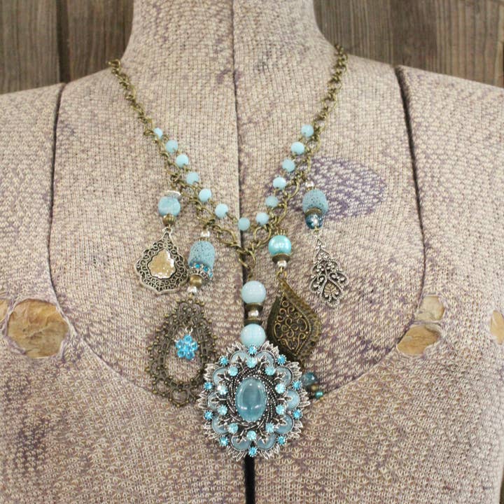 The Primitive Peddler, Inc. - Wholesale Pendant/Charm Necklace - Embellishments Of Bronze & Silver Charming Blue Pendant Layered Necklace