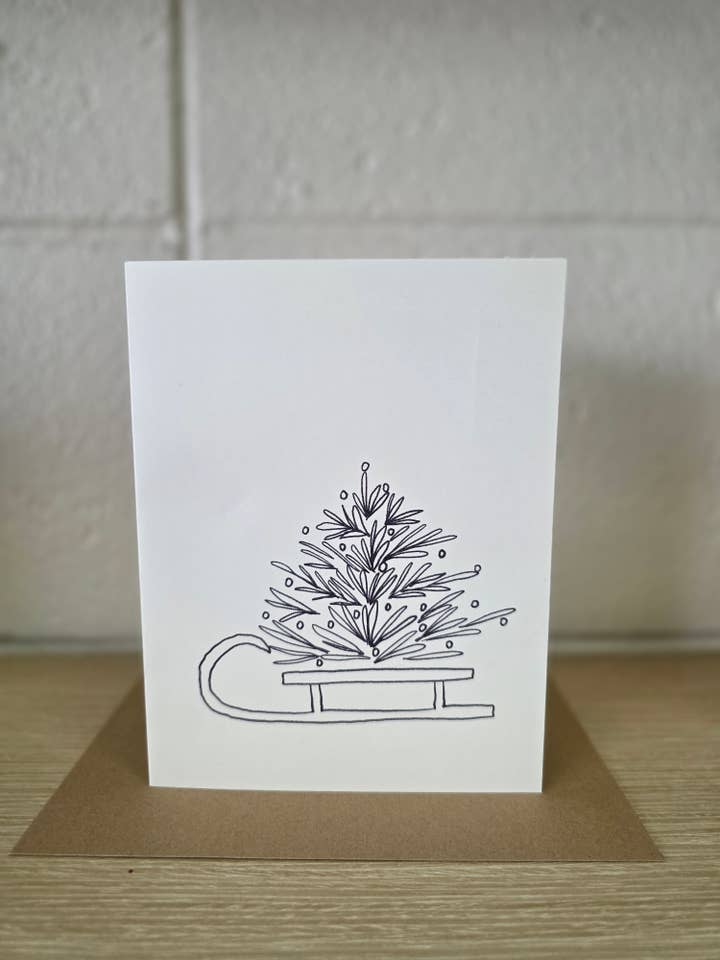 Christmas Tree on Sled Outline Greeting Card for wholesale by Covered With Art