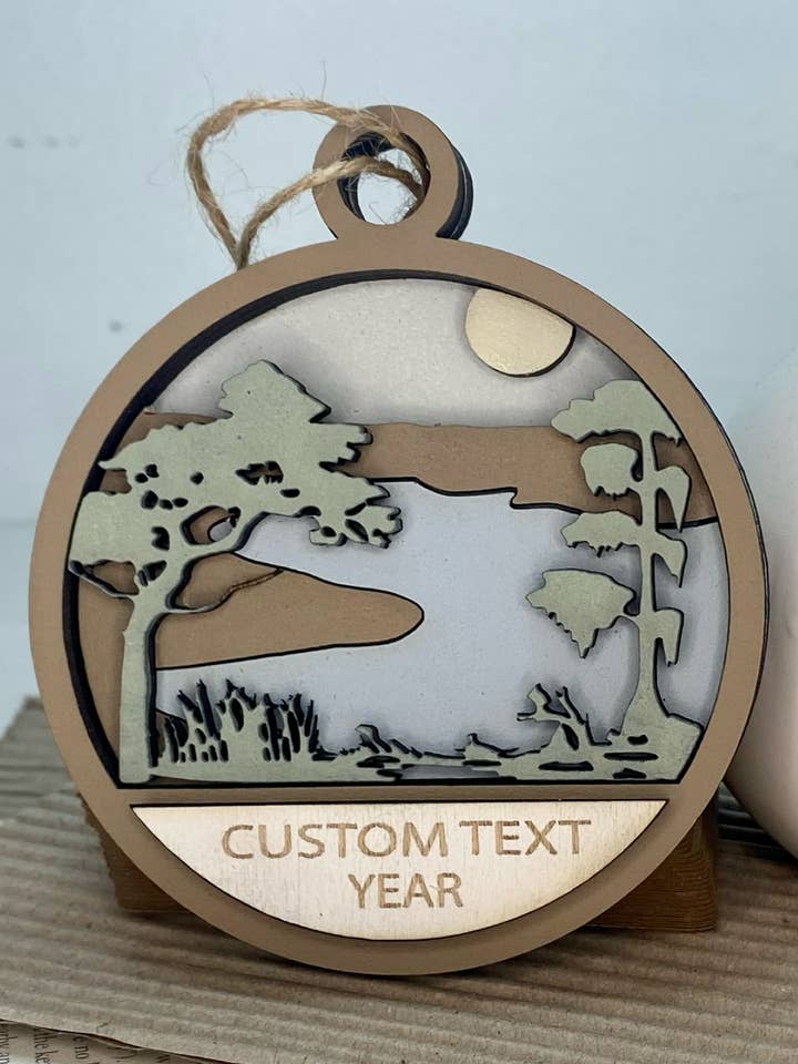 Any CityState or CustomText Winding Swamp Creek Ornament for wholesale by Pine Designs