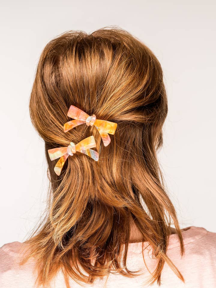 Marbeliseret bueklippar for engroshandel hos Violet & Brooks