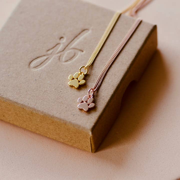 Gold Tiny Dog Paw Charm for wholesale by Justine Brooks Design