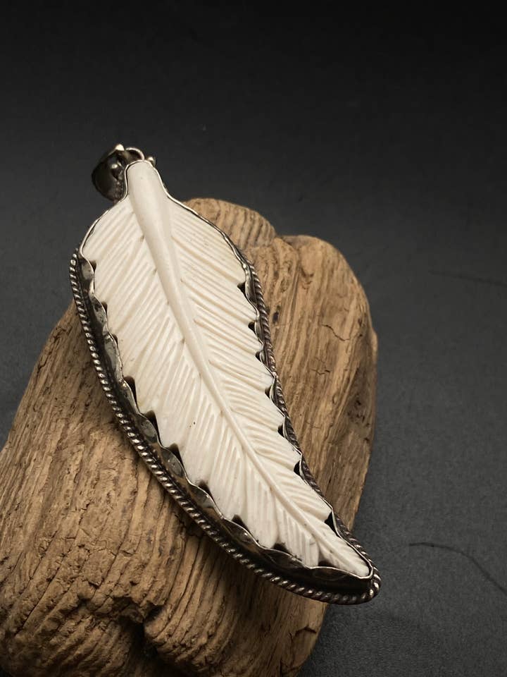 leaf pendant ,handcrafted, buffalo bone carved, white metal for wholesale by Third eye jewelry inc.