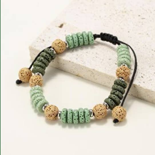 Bracelets made of round and flat beads in natural lava stone shade of green for wholesale by INNOBIZ