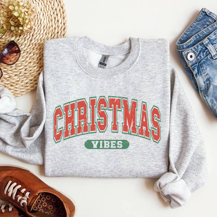 Refinery Number One LLC - Wholesale Graphic Sweatshirt - Women's - Christmas Vibes, Retro, Varsity, Santa, Snow Xmas Sweatshirt