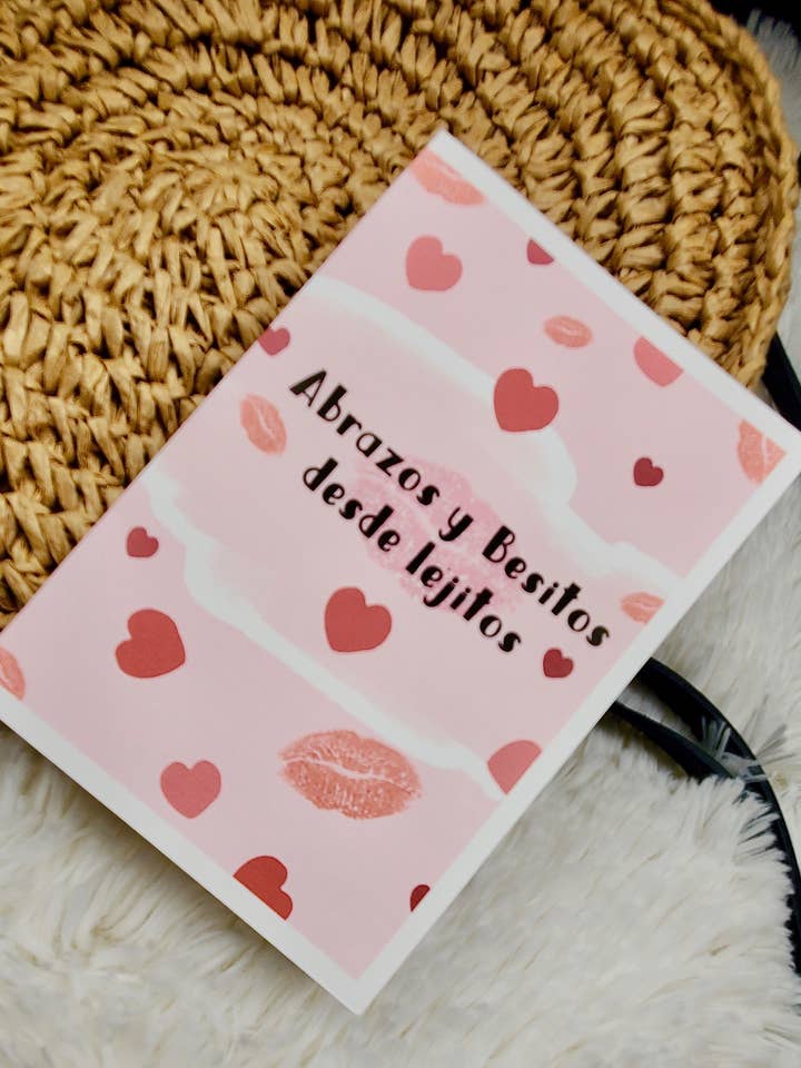 "Abrazos y Besitos desde Lejitos" Greeting Card, Spanish for wholesale by Rose Splash Creations