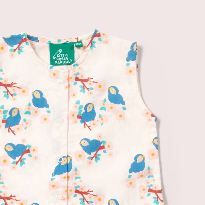 Bluebirds Button Ruffle Romper for wholesale on Faire1