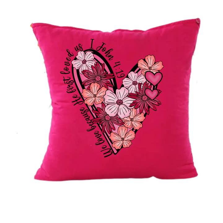 Coussin chrétien Il nous a aimés pour la première fois pour la vente par Love Ann Joy Apparel, LLC