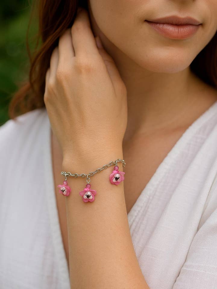 Handmade Pink Flower Charm Bracelet: Boho Floral Jewelry for wholesale by Bad Apple Designs