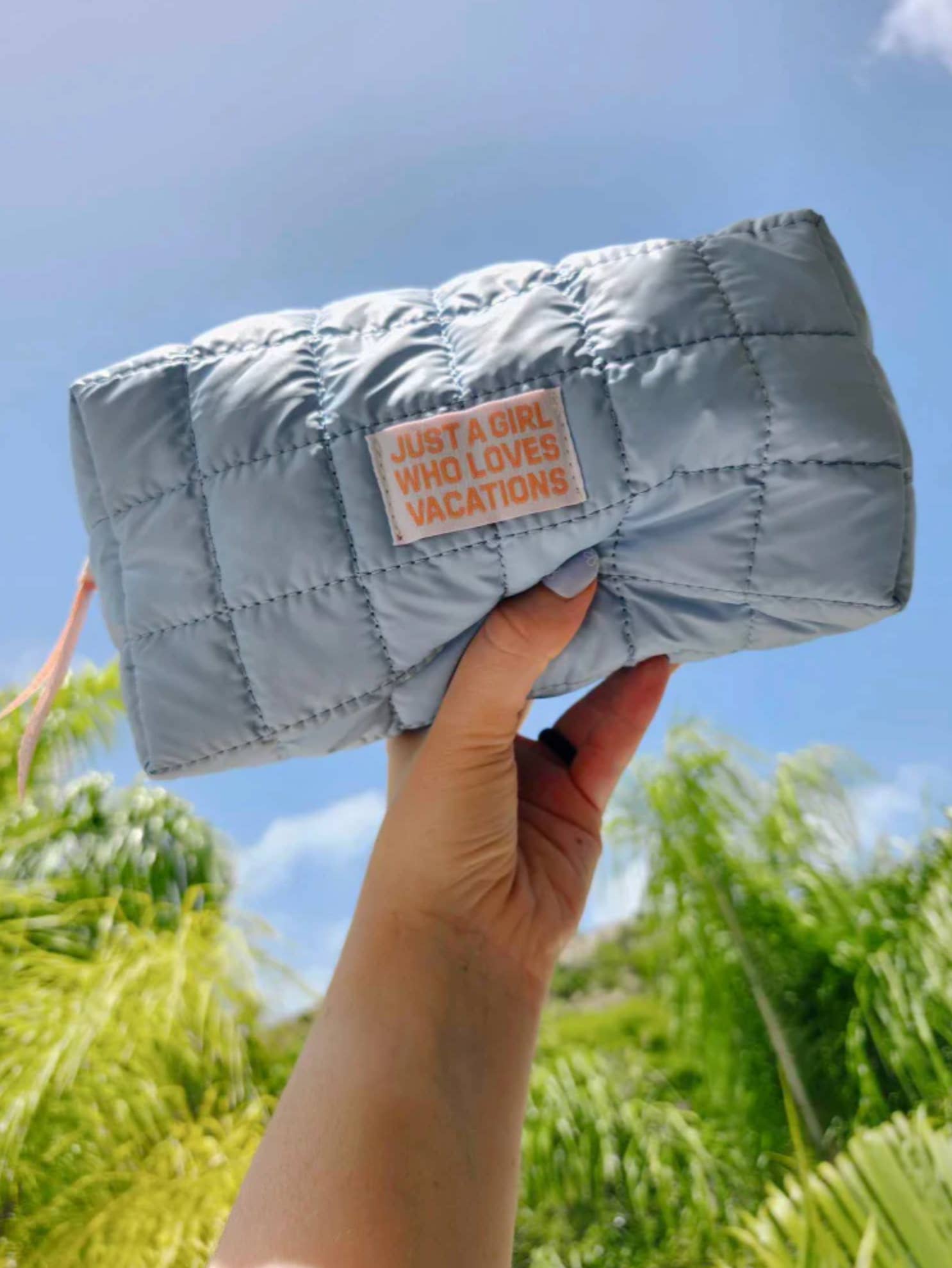 Just A Girl Who Loves Vacations Quilted Cosmetic Bag for wholesale by The Cold Hearted Collective