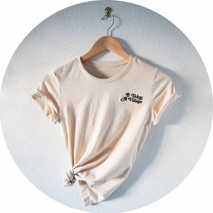 It Takes A Village® Fitted Embroidered Tee for wholesale by The Village