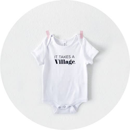 It Takes A Village® Onesie for wholesale by The Village